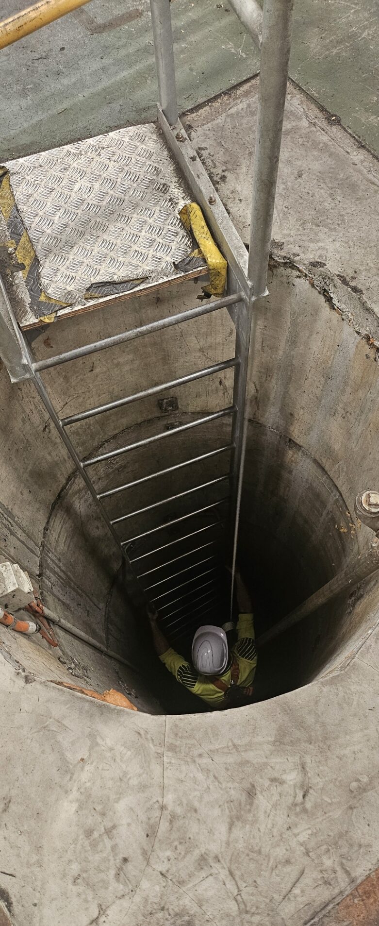 Trainees practising confined space entry and rescue techniques